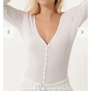white snap-front bodysuit from Garage